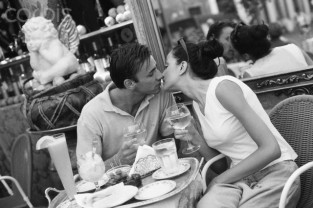 Couple Kissing at Restaurant